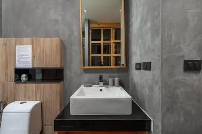 a bathroom with a white sink and a toilet at Modern studio at Relife 2 min to Nai Harn beach in Rawai Beach