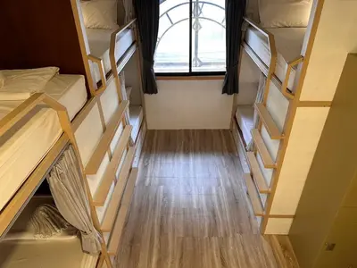 an overhead view of a dorm room with bunk beds at Terminal58hostel@town in Ban Lo Long
