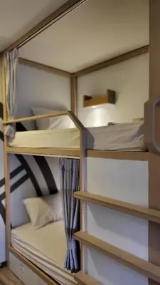 a room with several bunk beds in it at Terminal58hostel@town in Ban Lo Long