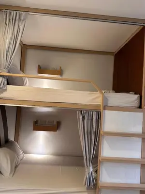 a room with two bunk beds in a room at Terminal58hostel@town in Ban Lo Long