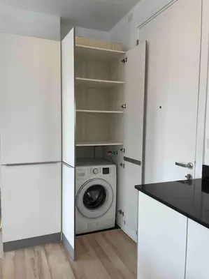 a white laundry room with a washing machine in it at Luxury condo in phuket shopping center in Phuket Town