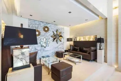 a living room with a couch and a table at Luxury condo in phuket shopping center in Phuket Town