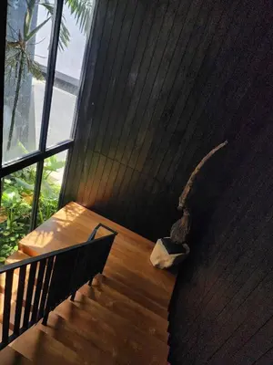 a set of stairs in a building with aigunigunigun at Luxury Beachfront AMANA Villa 4 Br at Ta-Ke Residence A in Phuket Town