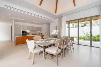 a dining room with a table and chairs at Spacious Mansion 4BR Villa Anchan V20 with 15m Private Pool in Gated Residence in Bang Tao Beach