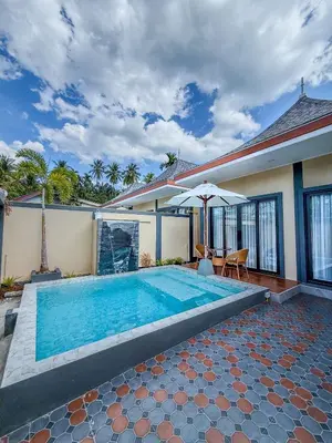a swimming pool in the backyard of a house at Luxury Boutique Pool Villa Ao Nang Krabi in Ao Nam Mao