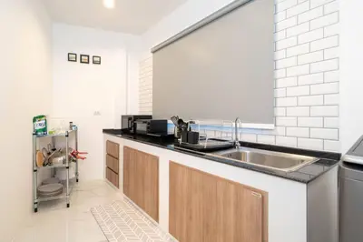 a kitchen with a sink and a counter top at 2BR townhome 300M walk to kata beach Fully equipped in Kata Beach