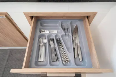 a drawer filled with utensils in a kitchen at 2BR townhome 300M walk to kata beach Fully equipped in Kata Beach