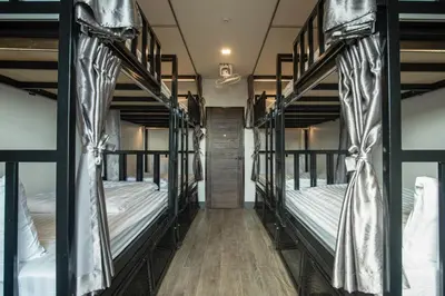 a group of bunk beds in a room at Sea Beach Hostel & Club Beachfront 18-39 years only in Ao Nang Beach