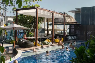 a group of people in the swimming pool at a resort at Sea Beach Hostel & Club Beachfront 18-39 years only in Ao Nang Beach