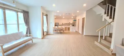 a living room with a couch and a table at 48 House in Patong Beach