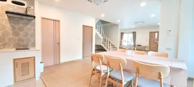 a kitchen and dining room with a table and chairs at 48 House in Patong Beach