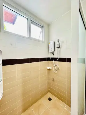 a bathroom with a shower and a window at Vibe Phuket Private Rooms in Shared Villa Some Shared Bathrooms in Phuket Town