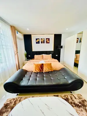 a bedroom with a bed with a black leather bed frame at Vibe Phuket Private Rooms in Shared Villa Some Shared Bathrooms in Phuket Town