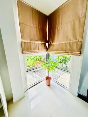 a window with a plant in a pot in a room at Vibe Phuket Private Rooms in Shared Villa Some Shared Bathrooms in Phuket Town