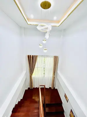 a staircase in a house with a window at Vibe Phuket Private Rooms in Shared Villa Some Shared Bathrooms in Phuket Town