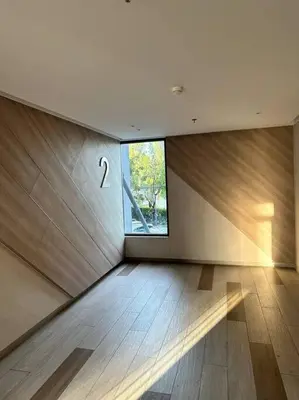 a room with a large window and a wooden floor at Квартира Cassia Residences Lake View in Bang Tao Beach