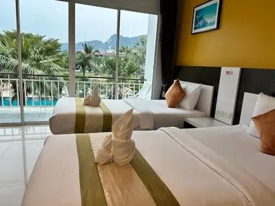 a hotel room with two beds and a large window at Gypsy Sea View Resort- Phi Phi Island in Phi Phi Don