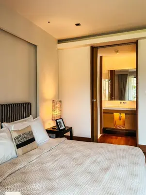 a bedroom with a large bed and a mirror at Pearl of Naithon 3 bedrooms in Nai Thon Beach