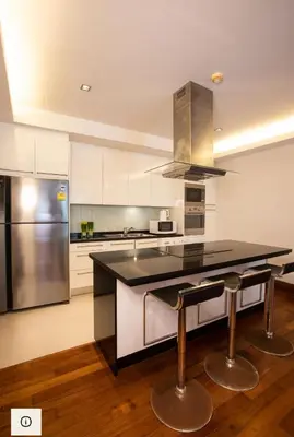 a kitchen with a black counter and stainless steel appliances at Pearl of Naithon 3 bedrooms in Nai Thon Beach