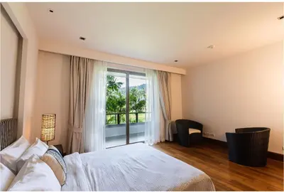 a bedroom with a bed and a large window at Pearl of Naithon 3 bedrooms in Nai Thon Beach