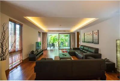 a living room with a couch and a table at Pearl of Naithon 3 bedrooms in Nai Thon Beach