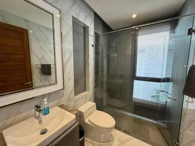 a bathroom with a toilet and a sink and a shower at Luxury Breeze Villa with private pool & maid in Bang Tao Beach