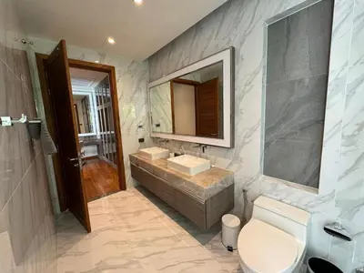 a bathroom with a sink and a mirror at Luxury Breeze Villa with private pool & maid in Bang Tao Beach
