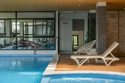 a swimming pool with a lounge chair and a swimming pool at Great Hill Tropic View Pool Gym Naiyang in Nai Yang Beach