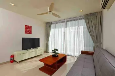 a living room with a couch and a flat screen tv at Big Lucky home in Laguna park in Bang Tao Beach