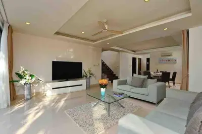 a living room with a couch and a tv at Big Lucky home in Laguna park in Bang Tao Beach
