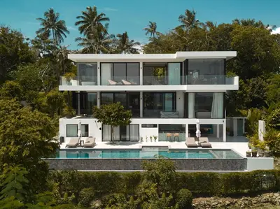 a large white house with a swimming pool at Casa Alma by Elite Havens in Nai Harn Beach