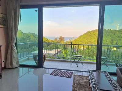 a living room with a view of the ocean at Seaview Eagles Nest Apartments in Rawai Beach
