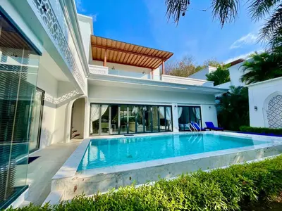 a swimming pool in the backyard of a house at Menara - 3 BR Private Pool Villa - Moroccan Inspired - Bangtao Beach in Phuket Town