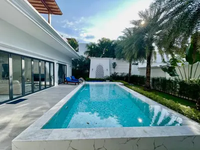 a swimming pool in the backyard of a house at Menara - 3 BR Private Pool Villa - Moroccan Inspired - Bangtao Beach in Phuket Town