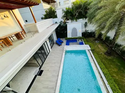 an aerial view of a house with a swimming pool at Menara - 3 BR Private Pool Villa - Moroccan Inspired - Bangtao Beach in Phuket Town