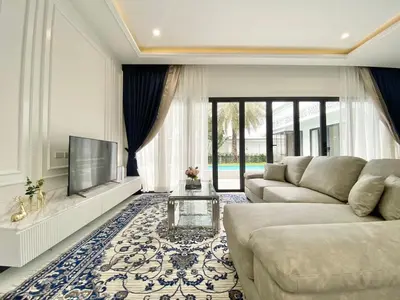 a living room with a couch and a tv at Menara - 3 BR Private Pool Villa - Moroccan Inspired - Bangtao Beach in Phuket Town