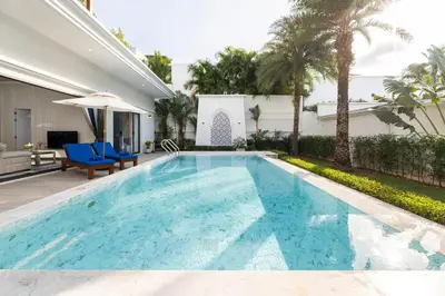 a swimming pool in the backyard of a house at Menara - 3 BR Private Pool Villa - Moroccan Inspired - Bangtao Beach in Phuket Town