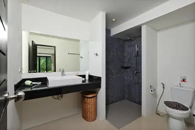 a bathroom with a sink and a shower at Thaimond Residence by TropicLook Walkable distance to Naiharn beach in Nai Harn Beach