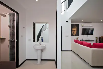a bathroom with a sink and a mirror at Thaimond Residence by TropicLook Walkable distance to Naiharn beach in Nai Harn Beach