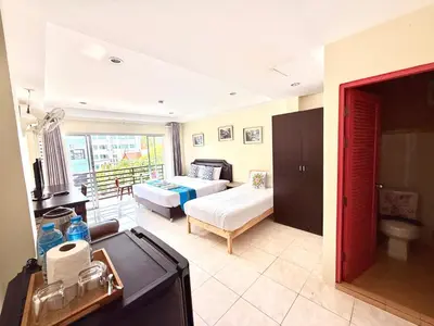 a living room with a bed and a couch at Thai Classic House in Patong Beach