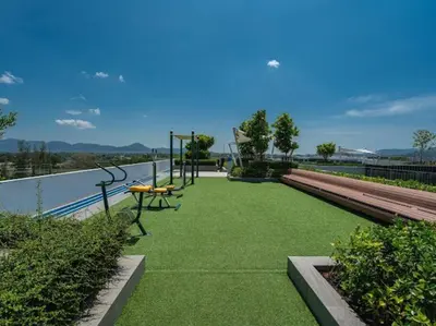 a park with a playground with green grass at 2 спальни Апартаменты на Бангтао 600 метров от моря in Bang Tao Beach