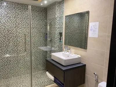 a bathroom with a sink and a shower at Studio with pool access - Twin Sands by Lofty in Patong Beach