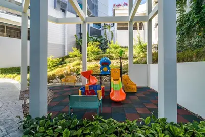 a patio with childrens play equipment on it at Studio with pool access - Twin Sands by Lofty in Patong Beach