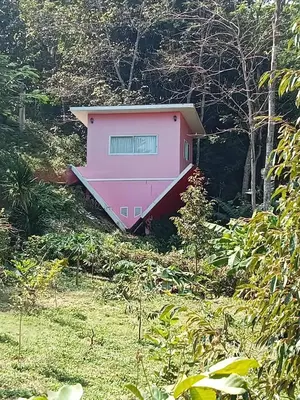 a pink house on the side of a hill at Mountain View Resort and Phupha Srirung Resort in Phuket Town