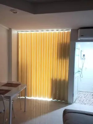 a room with a wooden partition with a table and a tableablish at Sleep tight Patong in Patong Beach