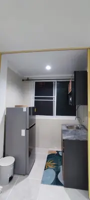 a small kitchen with a sink and a toilet at Sleep tight Patong in Patong Beach