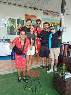 a group of people posing for a picture at Sweed Dee Seaview Hostel in Phi Phi Don