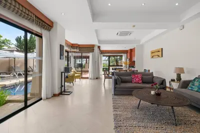 a living room with a couch and a table at Laguna Lakeview Villa in Layan Beach