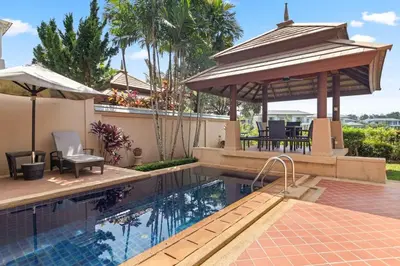 a swimming pool with a gazebo and an umbrella at Laguna Lakeview Villa in Layan Beach