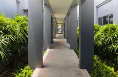 a hallway of an office building with plants at Вилла с бассейном на Най Харн, 2 спальни G3 in Rawai Beach